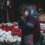 Florist arranging bouquets at her flower stall